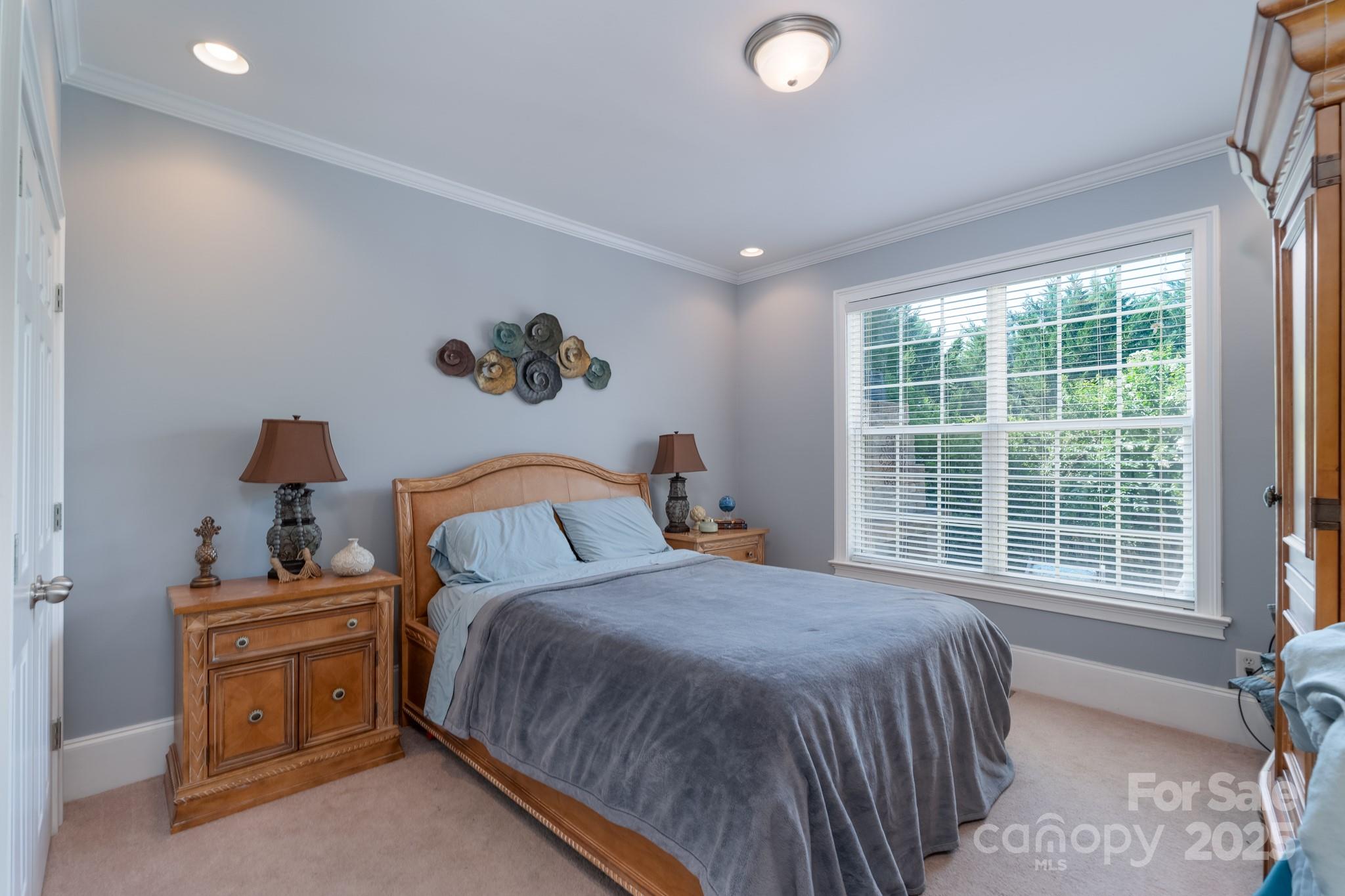 779 Fairway Point Drive Tega Cay, SC 29708 - Photo 31 of 48 a bedroom with a bed and a window