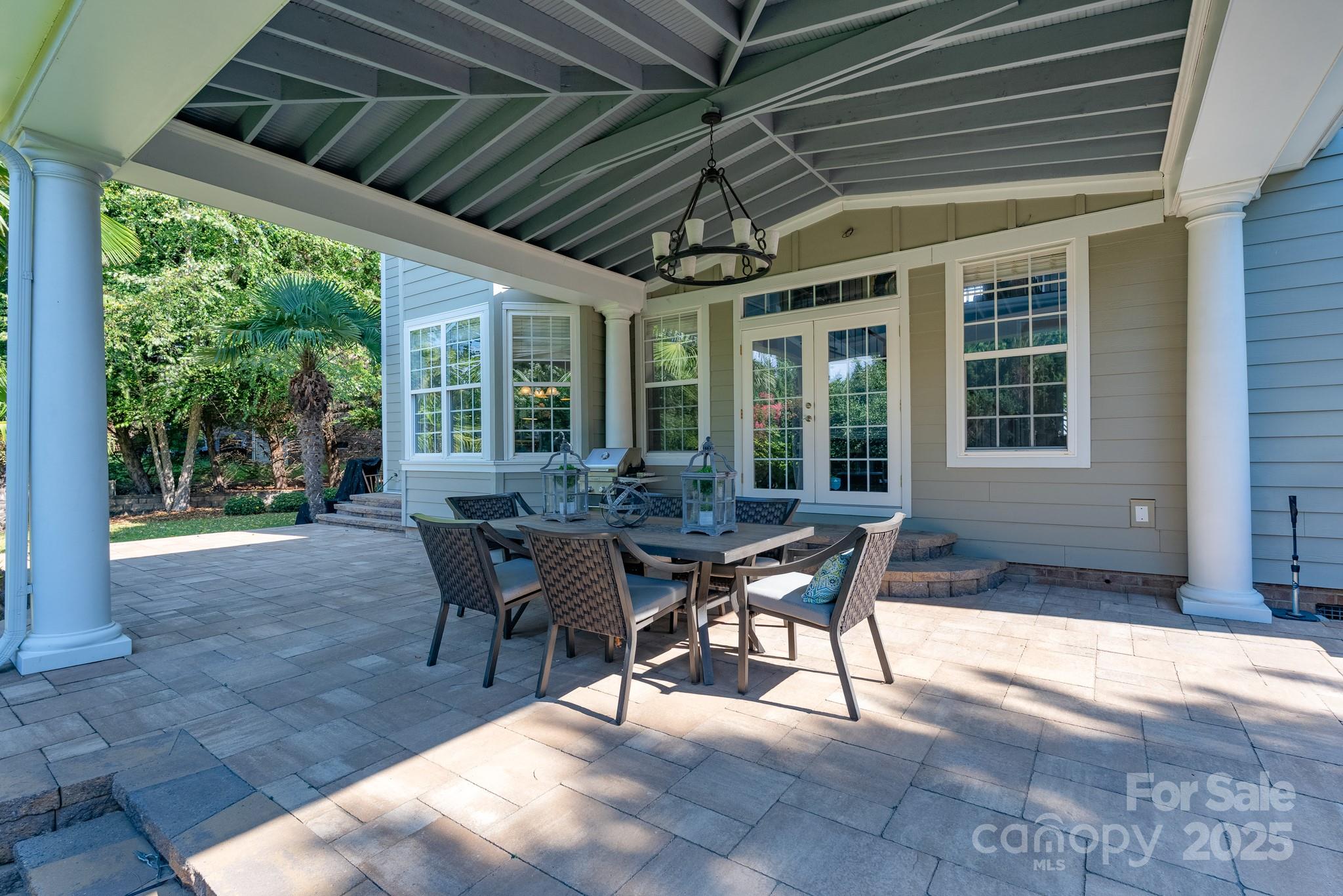 779 Fairway Point Drive Tega Cay, SC 29708 - Photo 36 of 48 a view of a patio with table and chairs