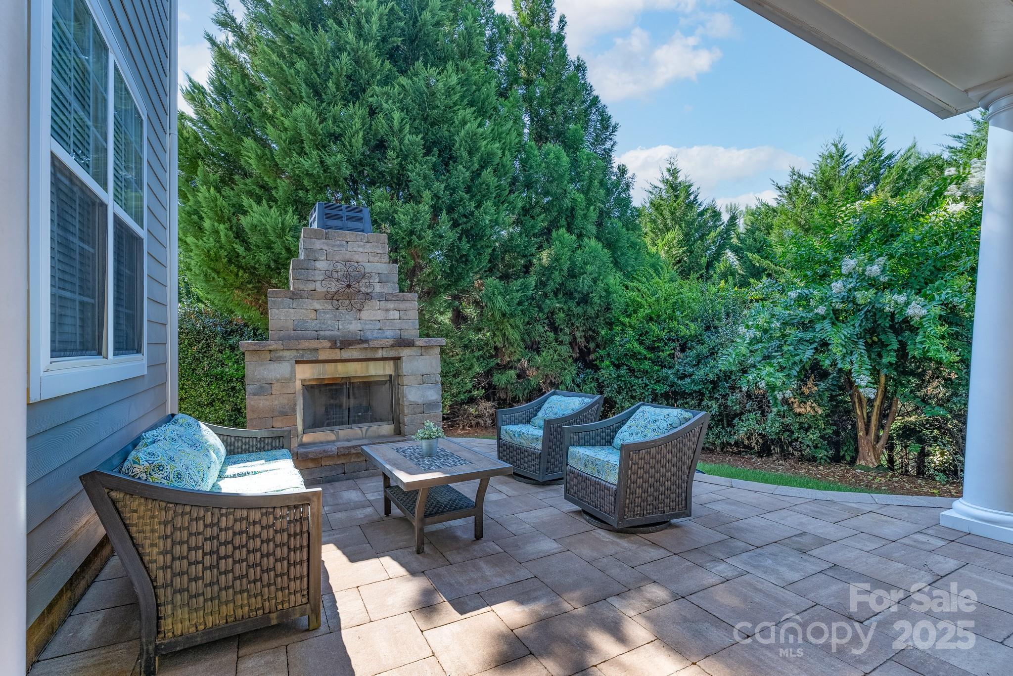 779 Fairway Point Drive Tega Cay, SC 29708 - Photo 39 of 48 a view of a patio with a chairs and table in a patio