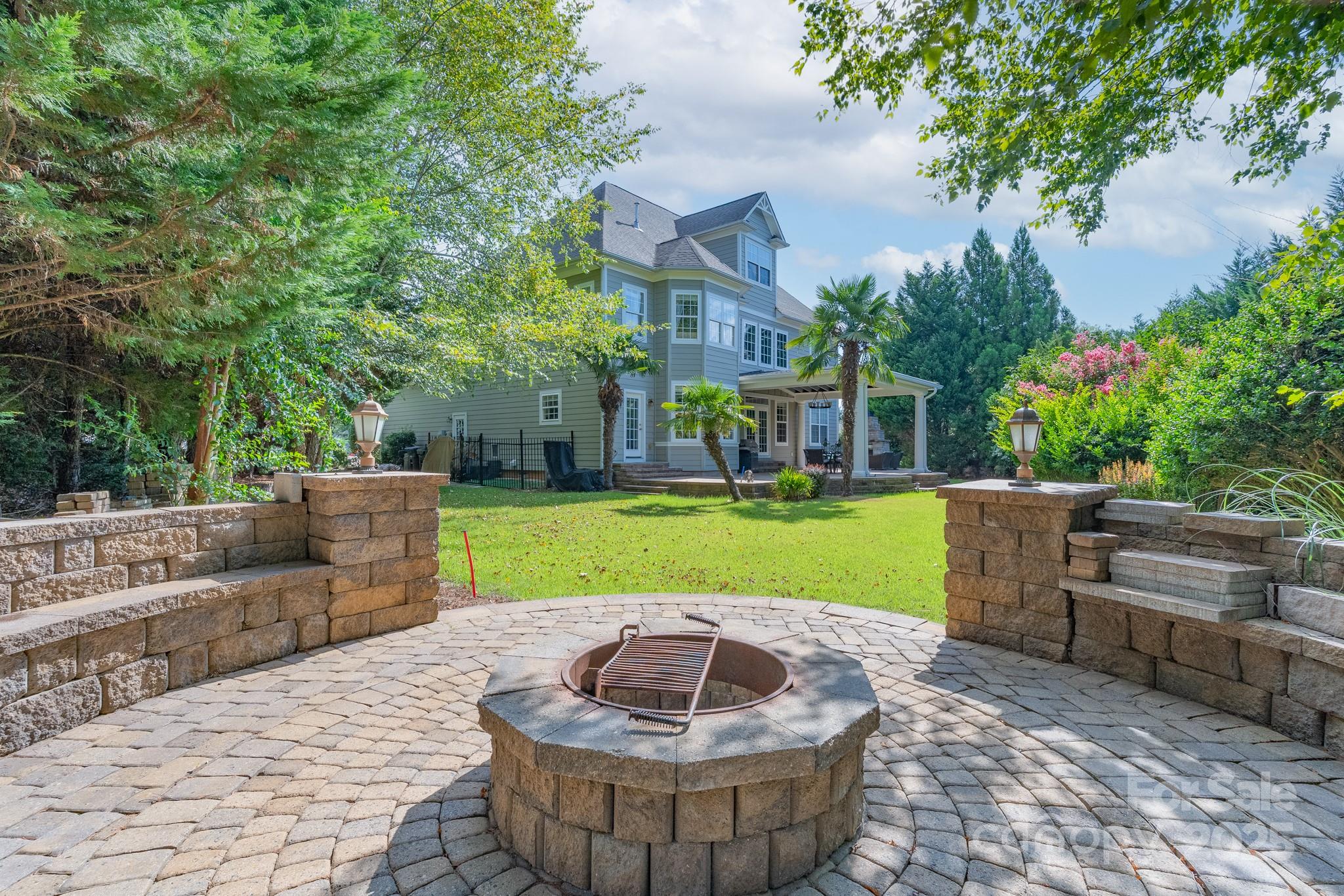 779 Fairway Point Drive Tega Cay, SC 29708 - Photo 41 of 48 a view of an house with backyard space and outdoor seating