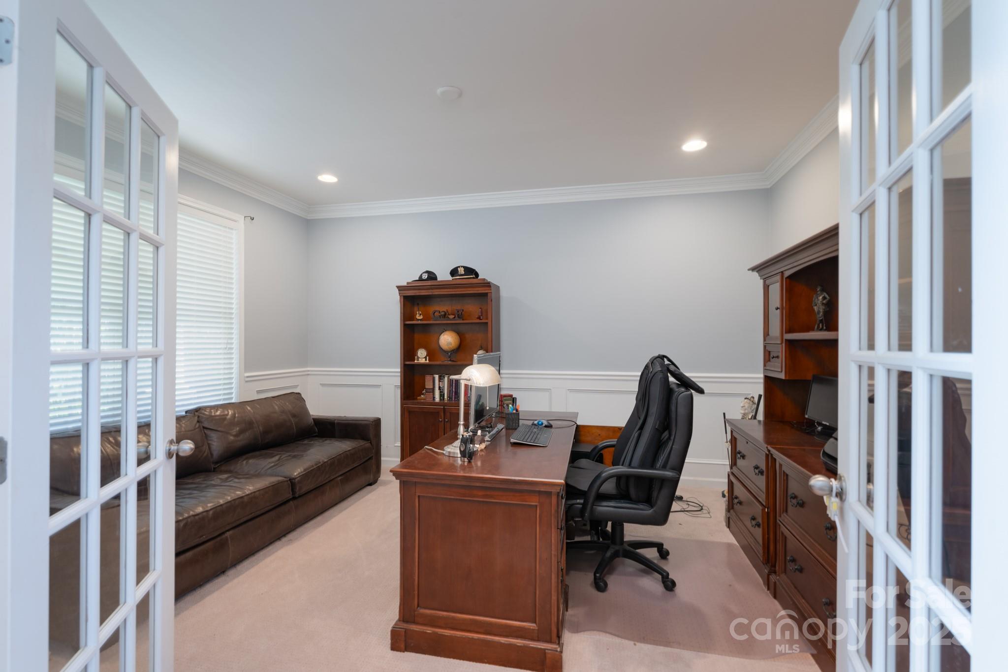 779 Fairway Point Drive Tega Cay, SC 29708 - Photo 7 of 48 a livingroom with workspace and a window