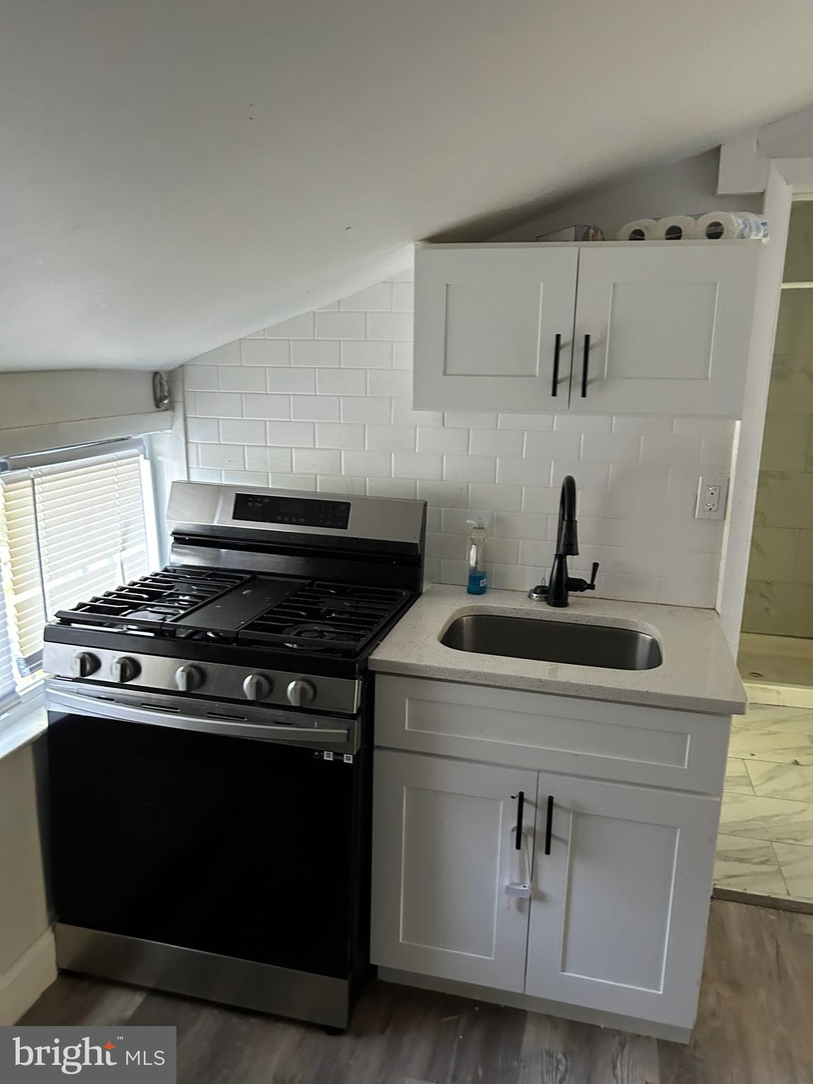 a kitchen with a stove and a microwave