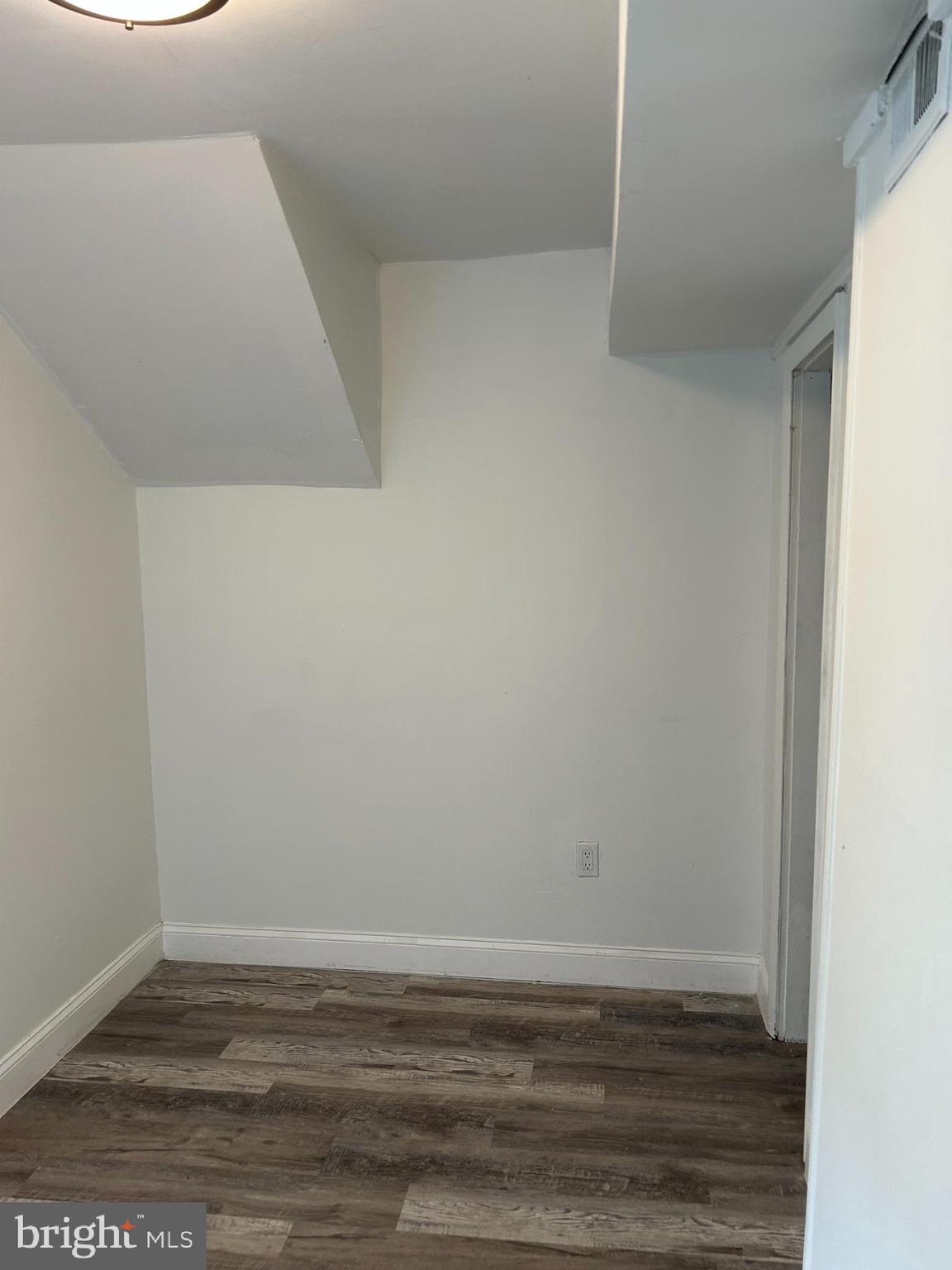 253 Harding Avenue, Unit 3 Clementon, NJ 08021 - Photo 6 of 9 a view of an empty room with wooden floor