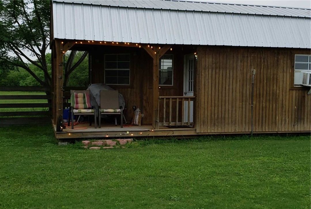 12212 County Road 1336 Sinton, TX 78387 - Photo 13 of 15 a view of a small house with backyard