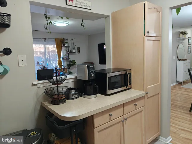 a kitchen with sink cabinets and stainless steel appliances