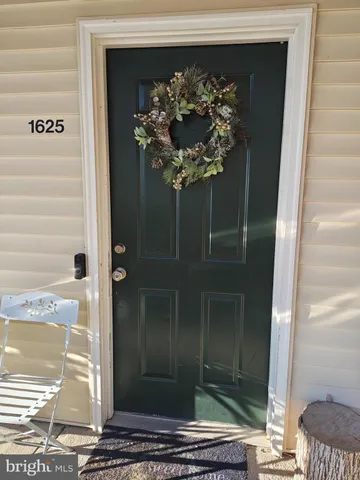 a vase of flowers sitting on a floor