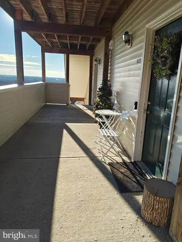 a view of a balcony with chairs