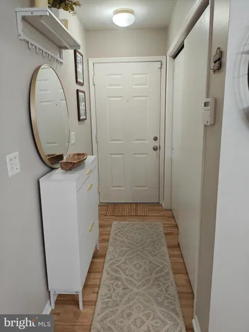 a view of a hallway with washer and dryer