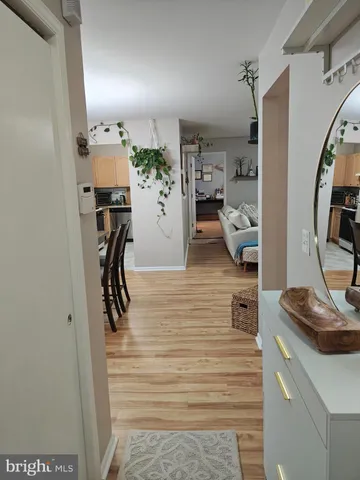 a view of a hallway with living room and furniture