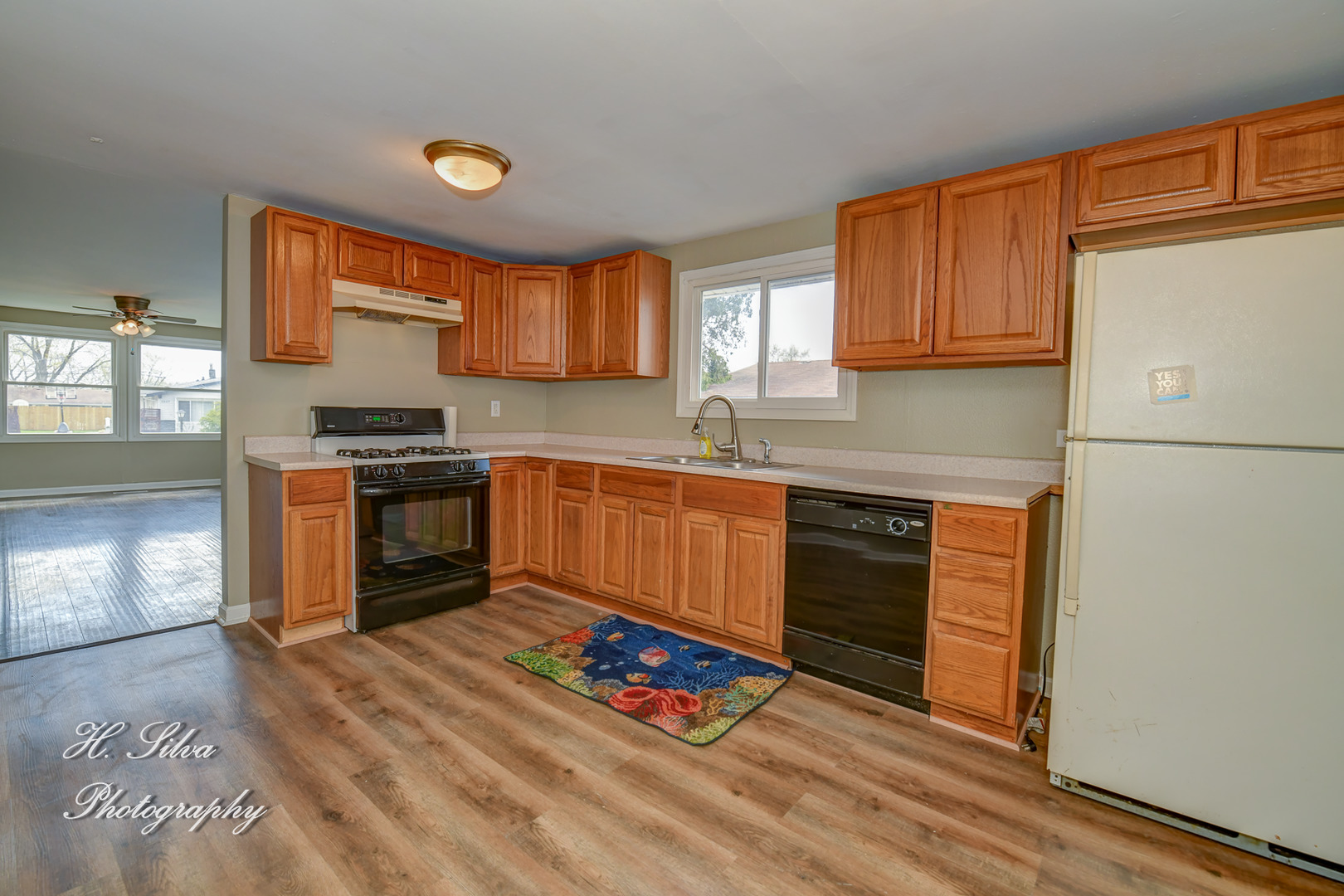 1516 Pawnee Road Carpentersville, IL 60110 - Photo 5 of 12 a kitchen with granite countertop a stove top oven sink and cabinets