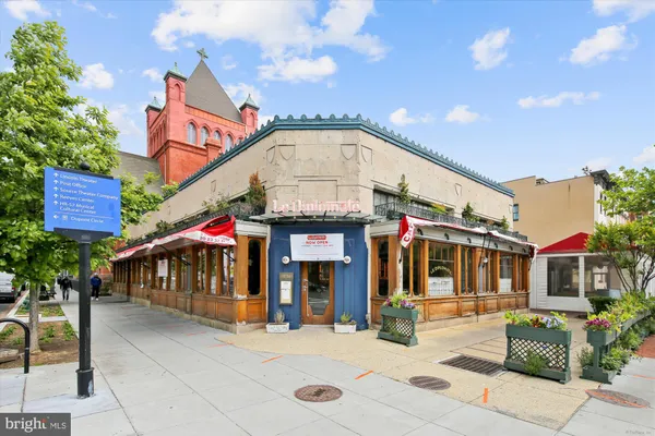 a front view of a building with retail shops