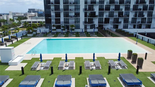 a view of swimming pool with outdoor seating