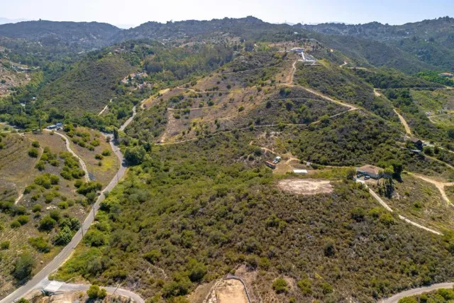 a view of a mountain range with trees in the background