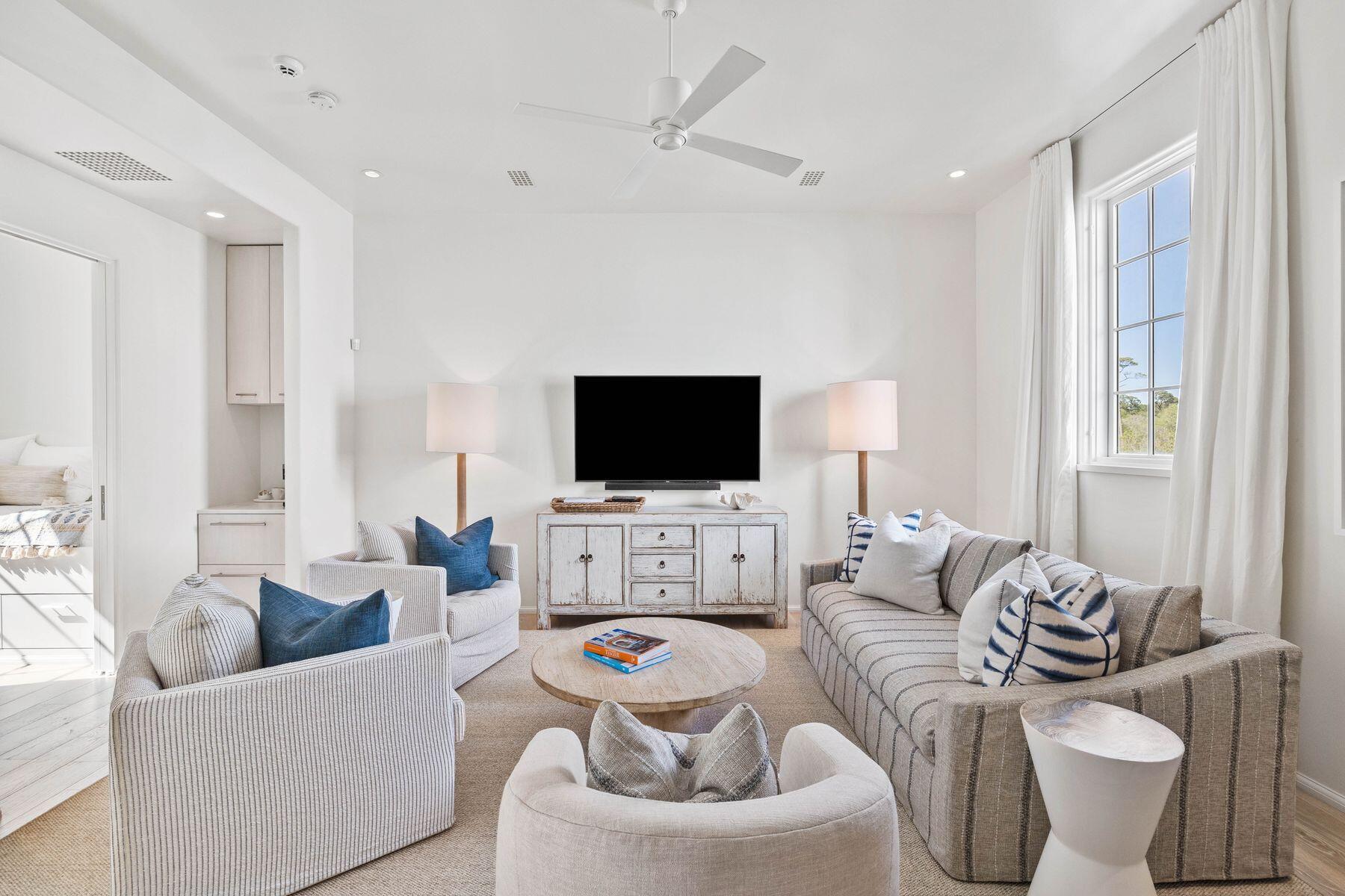 74 Kaiya Ave Inlet Beach Inlet Beach, FL 32461 - Photo 32 of 49 a living room with furniture and a flat screen tv