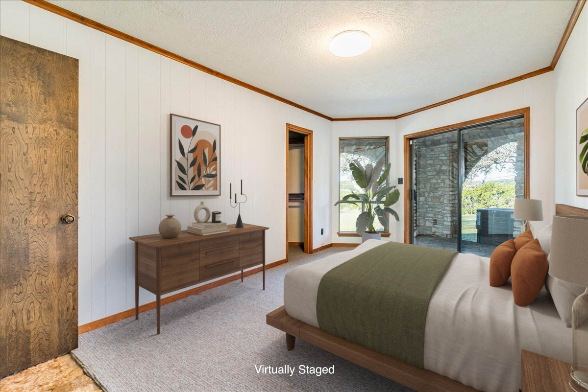 9763 Ranch Road 1623 Blanco, TX 78606 - Photo 22 of 40 a bedroom with a bed and a table