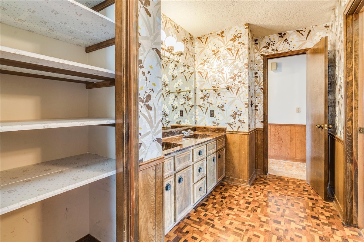 9763 Ranch Road 1623 Blanco, TX 78606 - Photo 23 of 40 a bathroom with a double vanity sink and a mirror
