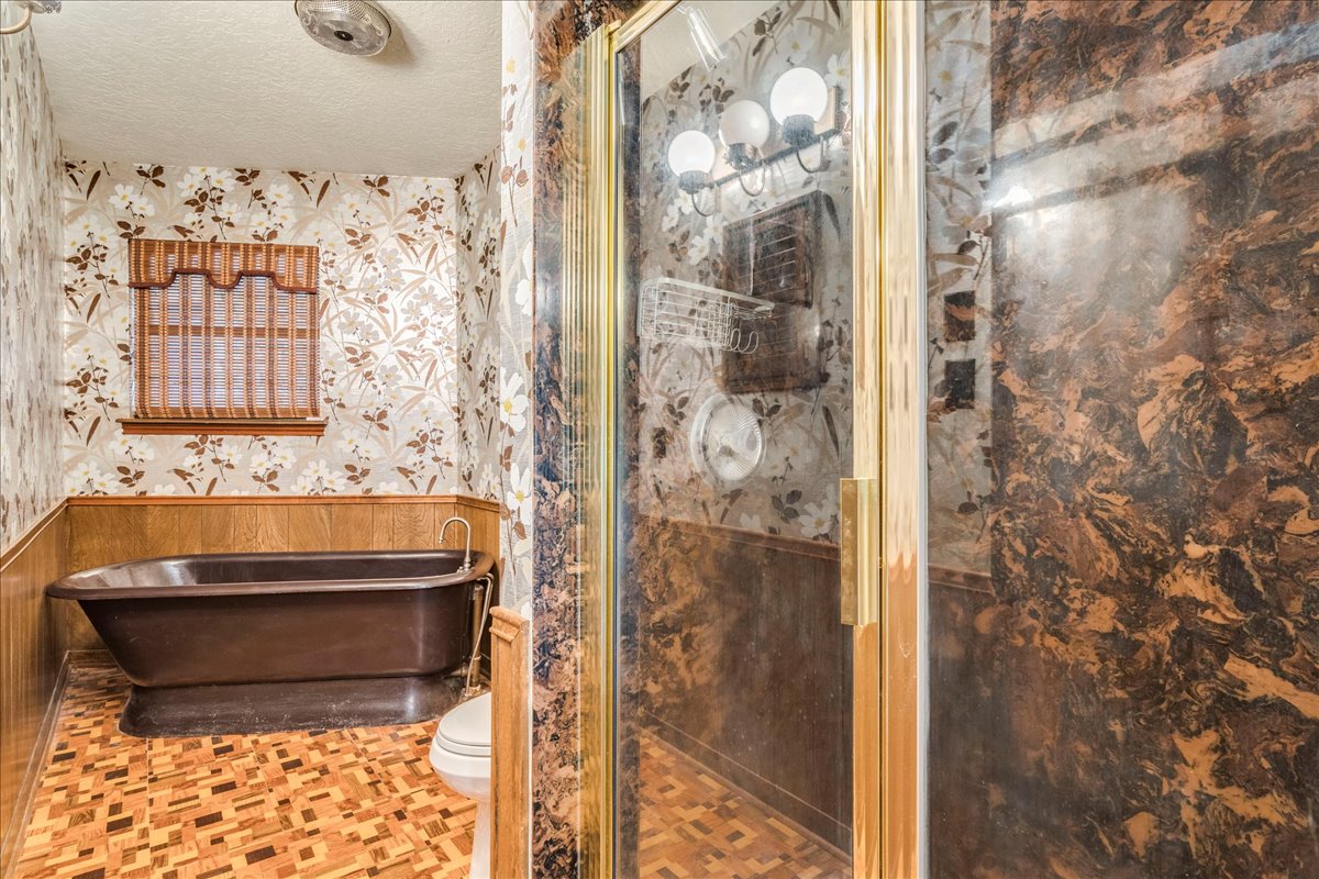 9763 Ranch Road 1623 Blanco, TX 78606 - Photo 24 of 40 a bathroom with a bathtub and shower