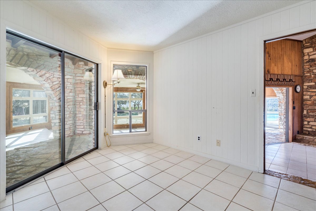 9763 Ranch Road 1623 Blanco, TX 78606 - Photo 31 of 40 White ceramic tile flooring extending throughout the space