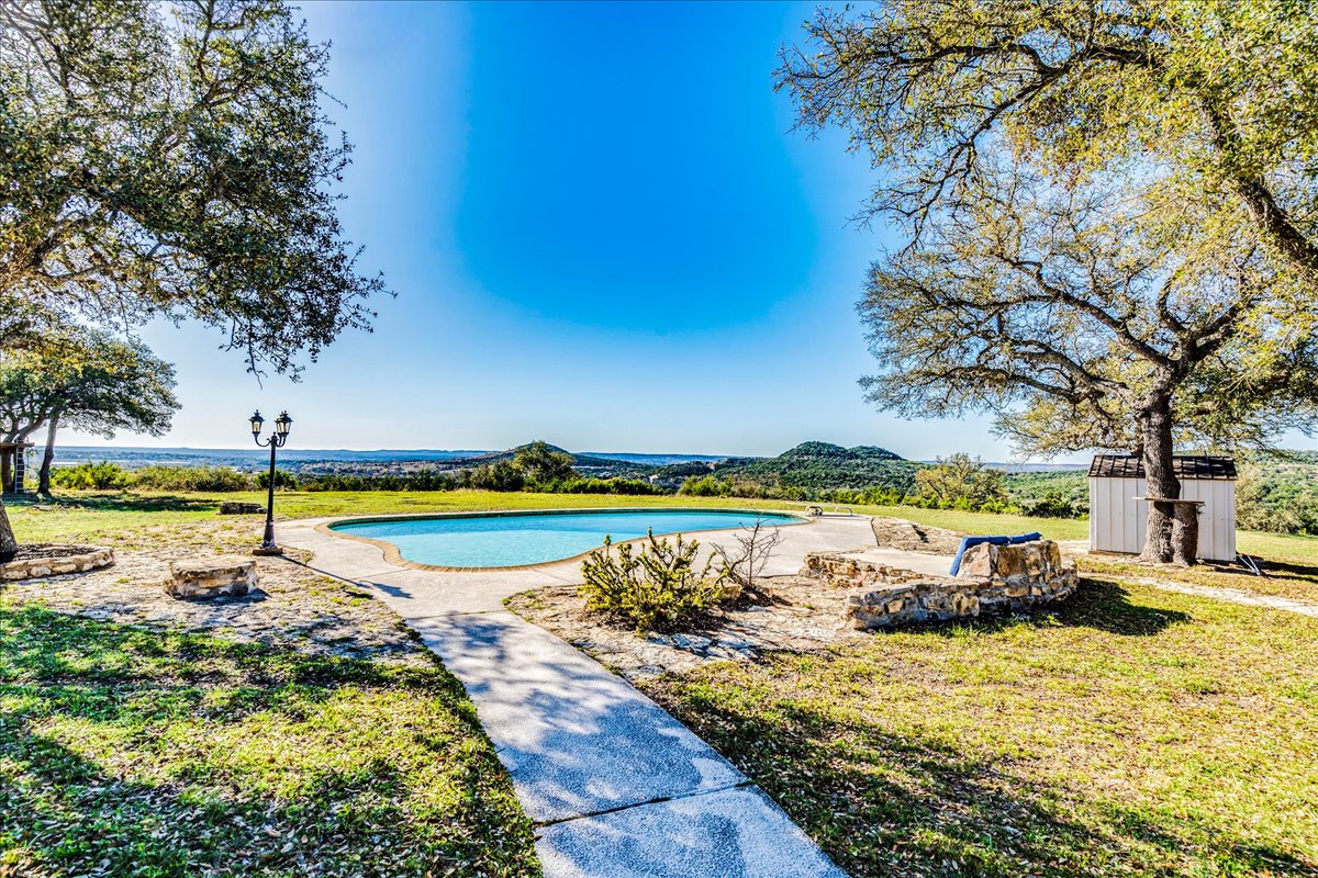 9763 Ranch Road 1623 Blanco, TX 78606 - Photo 31 of 40 a view of a swimming pool and outdoor space