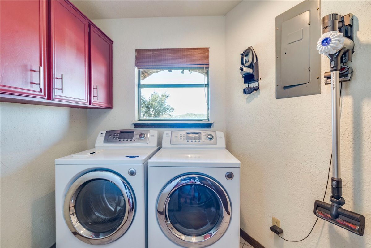 9763 Ranch Road 1623 Blanco, TX 78606 - Photo 32 of 40 a utility room with dryer and washer