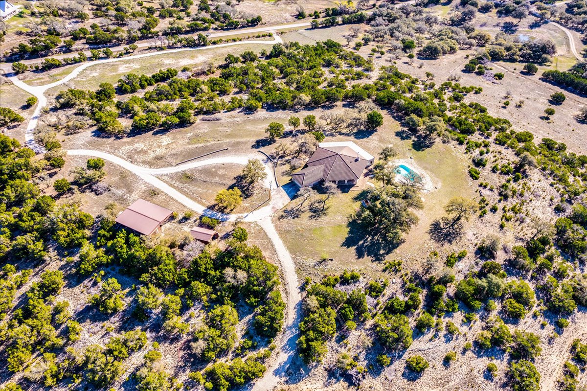 9763 Ranch Road 1623 Blanco, TX 78606 - Photo 36 of 40 an aerial view of residential houses with outdoor space