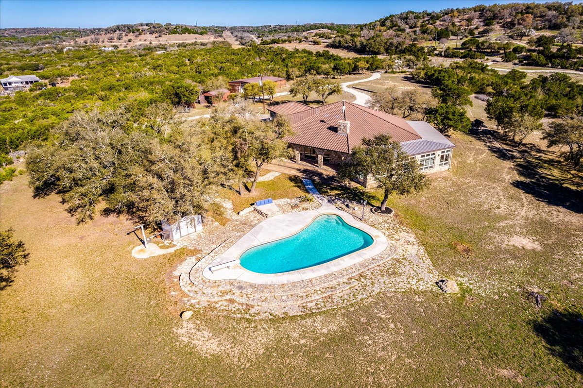 9763 Ranch Road 1623 Blanco, TX 78606 - Photo 37 of 40 an aerial view of residential houses with outdoor space