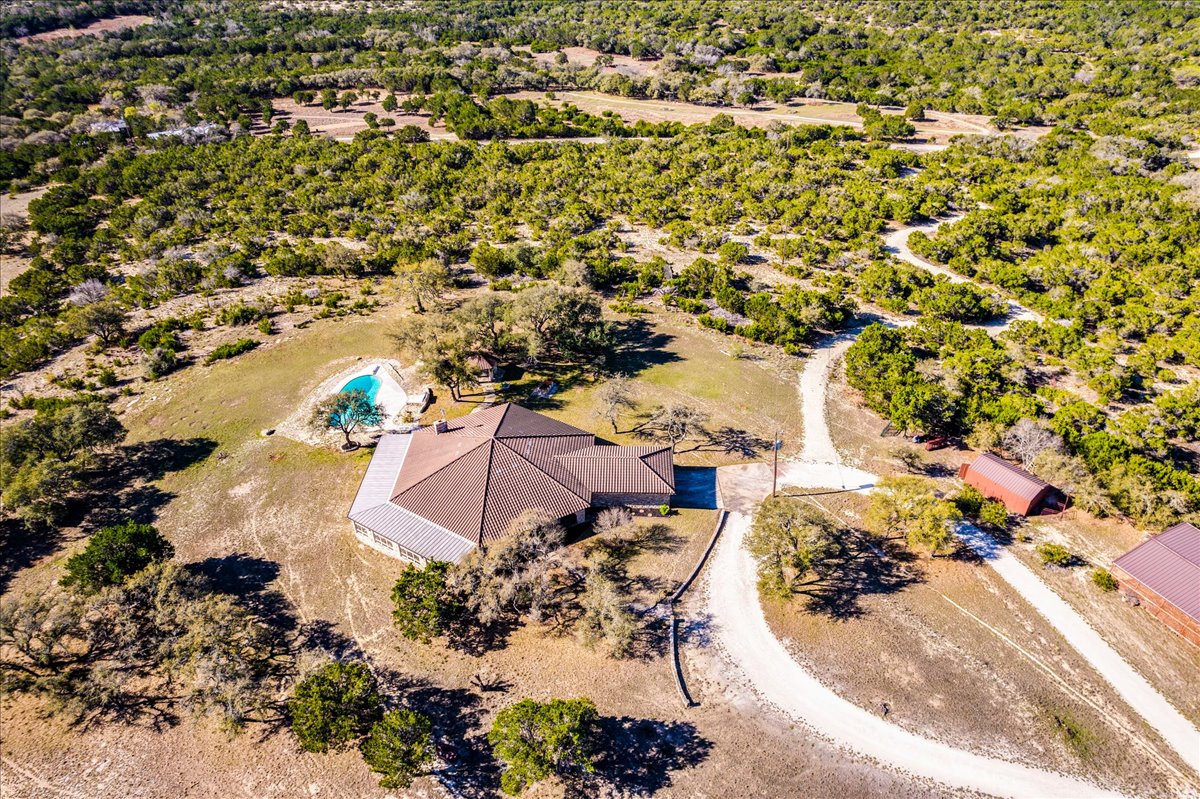 9763 Ranch Road 1623 Blanco, TX 78606 - Photo 6 of 40 an aerial view of a house with a yard