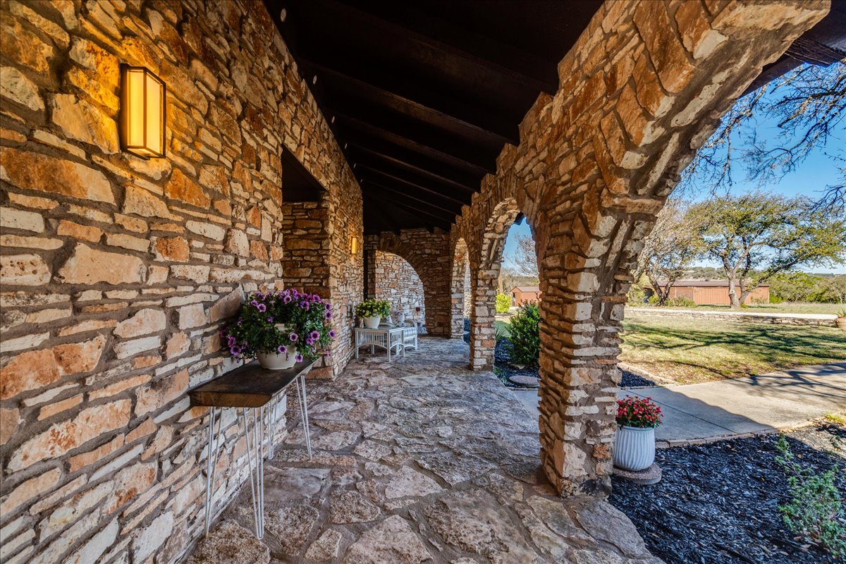 9763 Ranch Road 1623 Blanco, TX 78606 - Photo 8 of 40 a street view with tall buildings