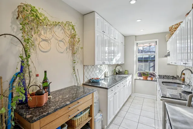 a kitchen with a stove and a sink