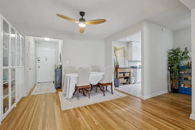 a view of a livingroom with furniture and hardwood floor