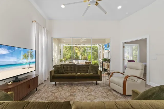 a front view of a house with a garden and trees