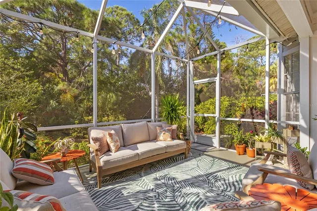 a room with gym equipment and floor to ceiling window