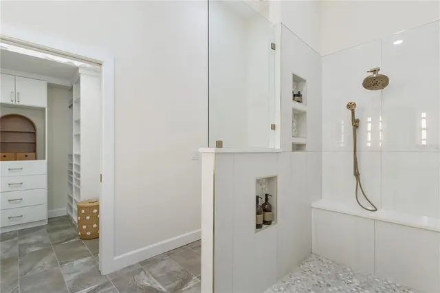 a view of a green field with trees in the background