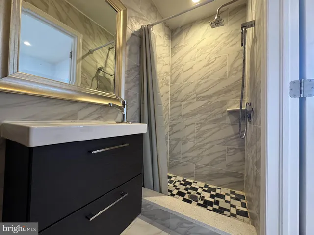 a bathroom with a sink and a shower