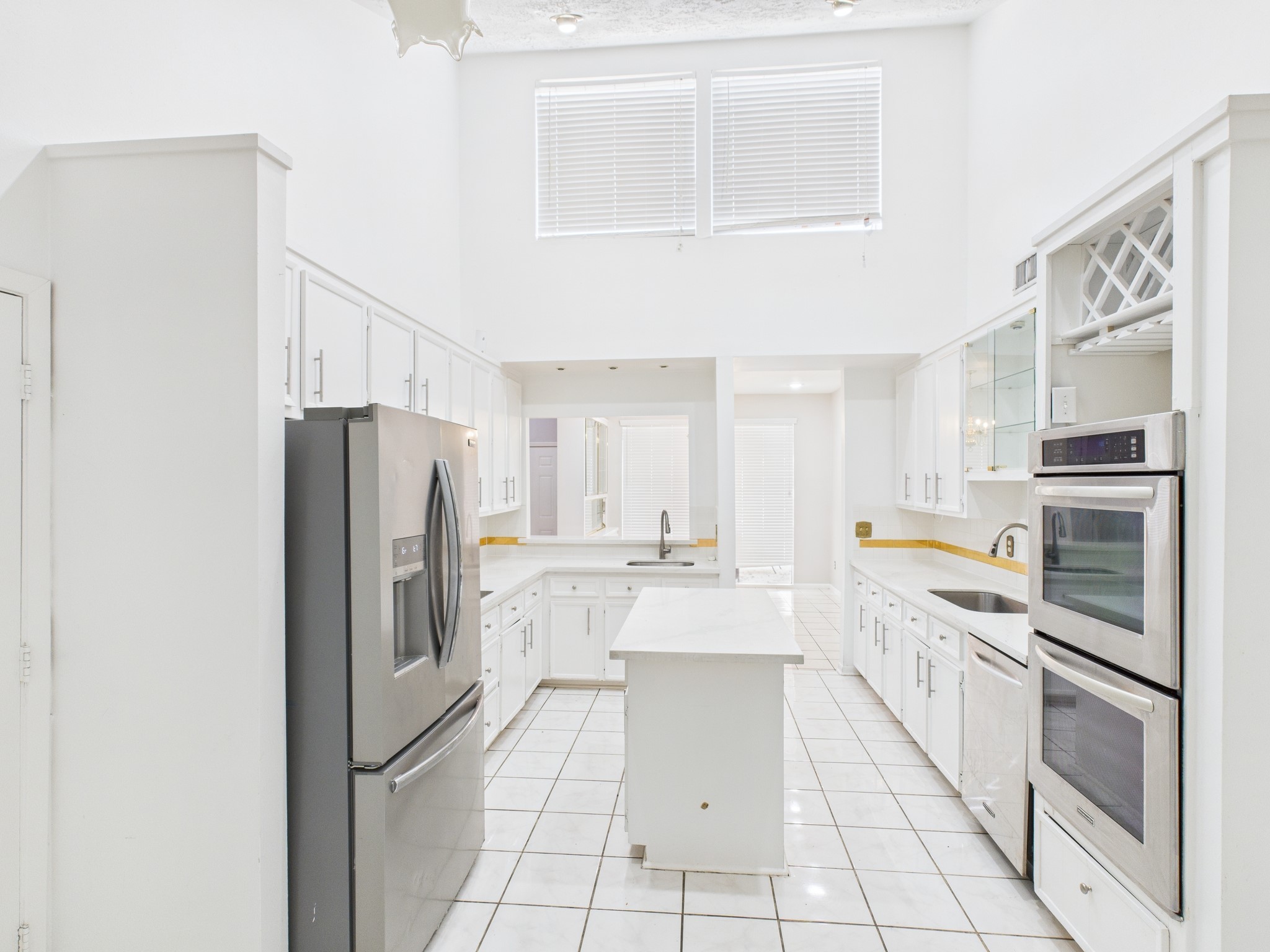 7611 Hopewell Lane Houston, TX 77071 - Photo 11 of 30 a kitchen with stainless steel appliances a refrigerator sink and cabinets
