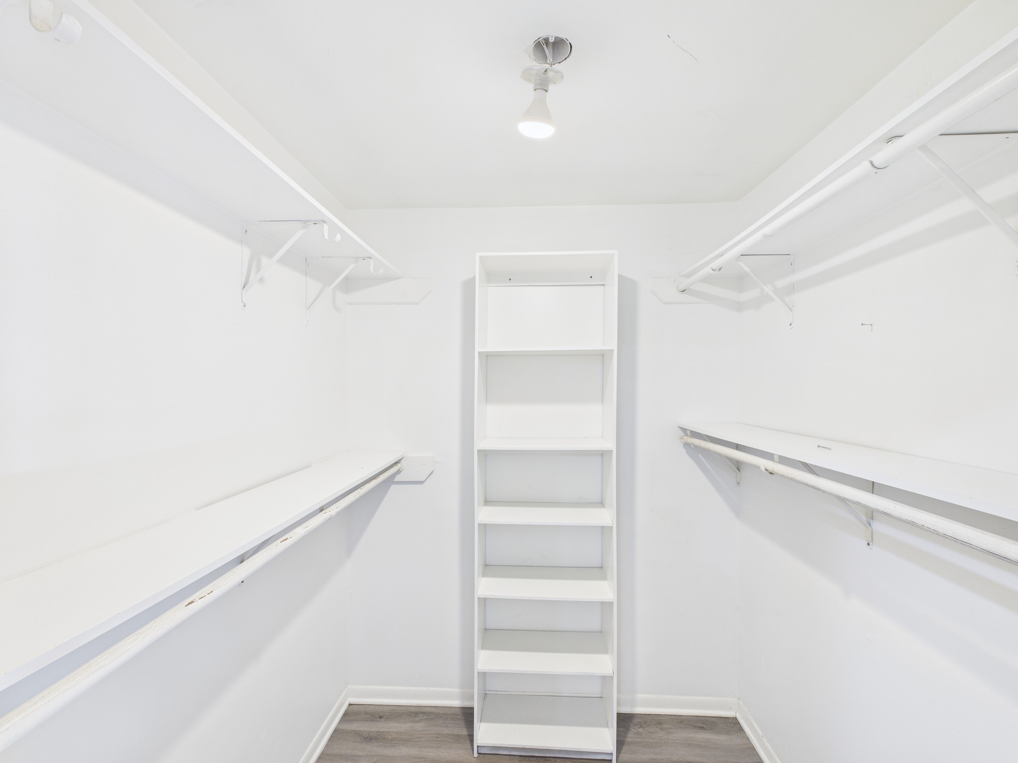 7611 Hopewell Lane Houston, TX 77071 - Photo 20 of 30 a view of walk in closet with empty racks