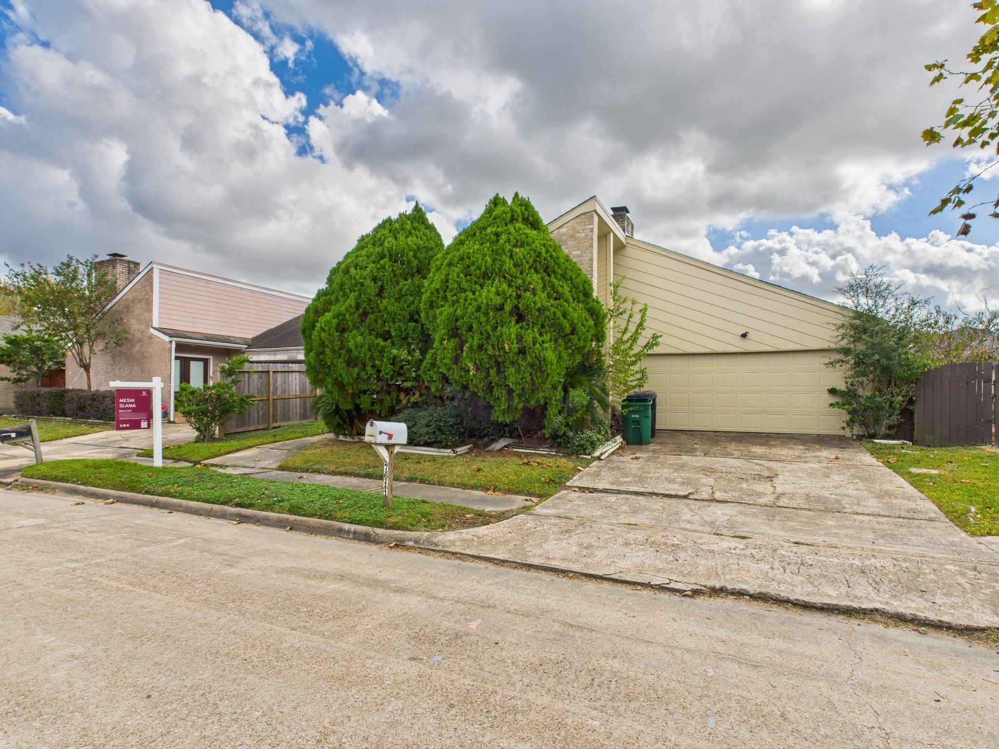 7611 Hopewell Lane Houston, TX 77071 - Photo 2 of 30 a white house with a big yard and a large trees with in front of it