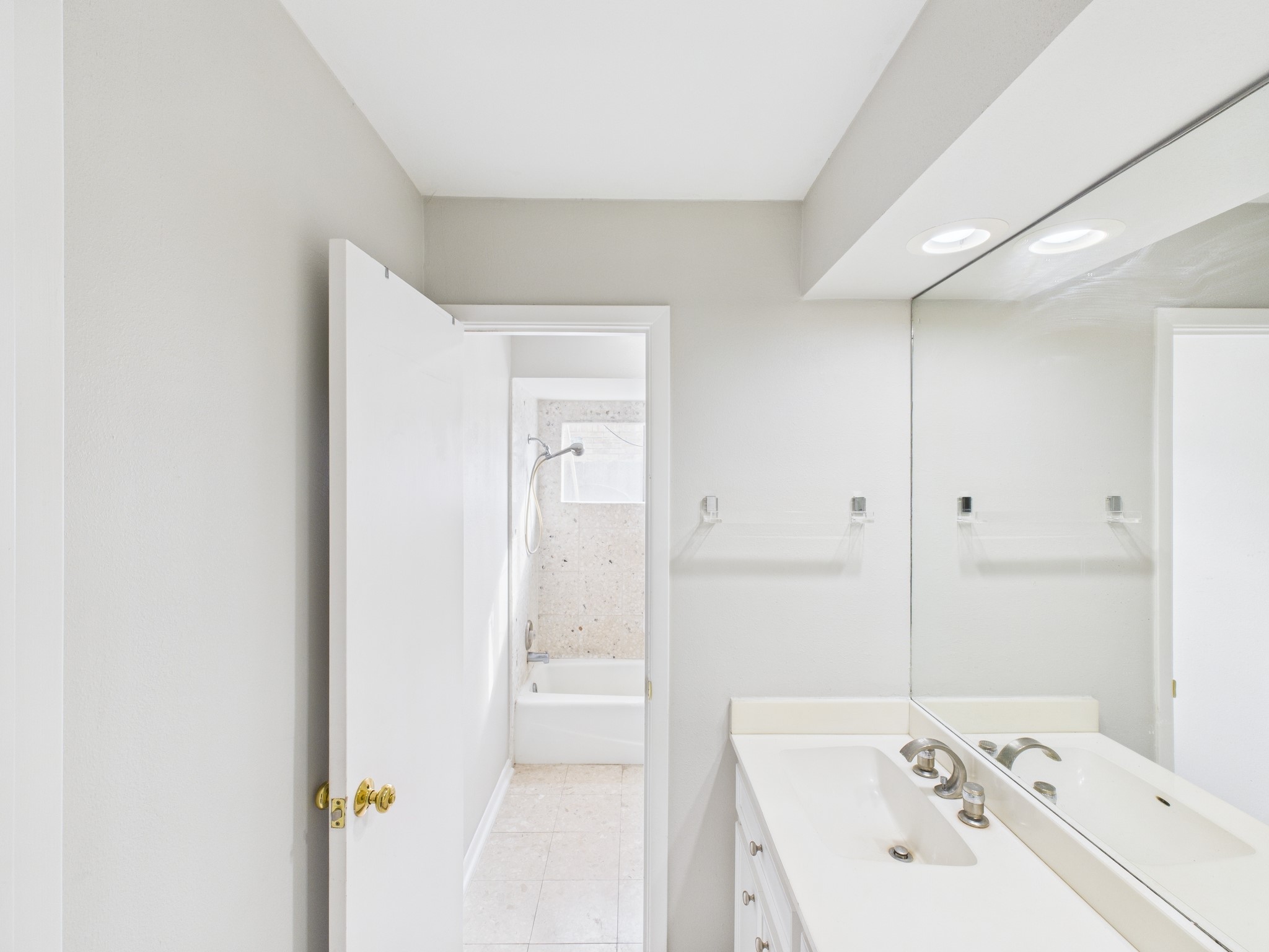 7611 Hopewell Lane Houston, TX 77071 - Photo 21 of 30 a bathroom with a bathtub and a sink