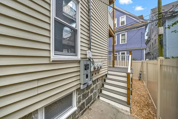 a view of a house with a door and a stairs