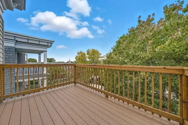 a view of balcony with wooden floor