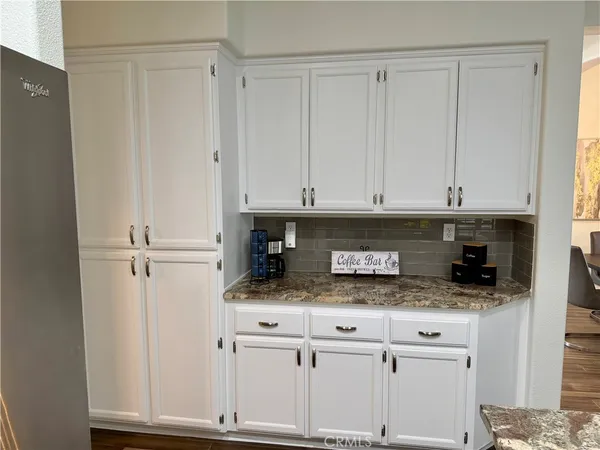 a bathroom with a sink toilet and mirror
