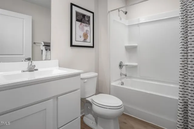 a spacious bedroom with a bed and a window