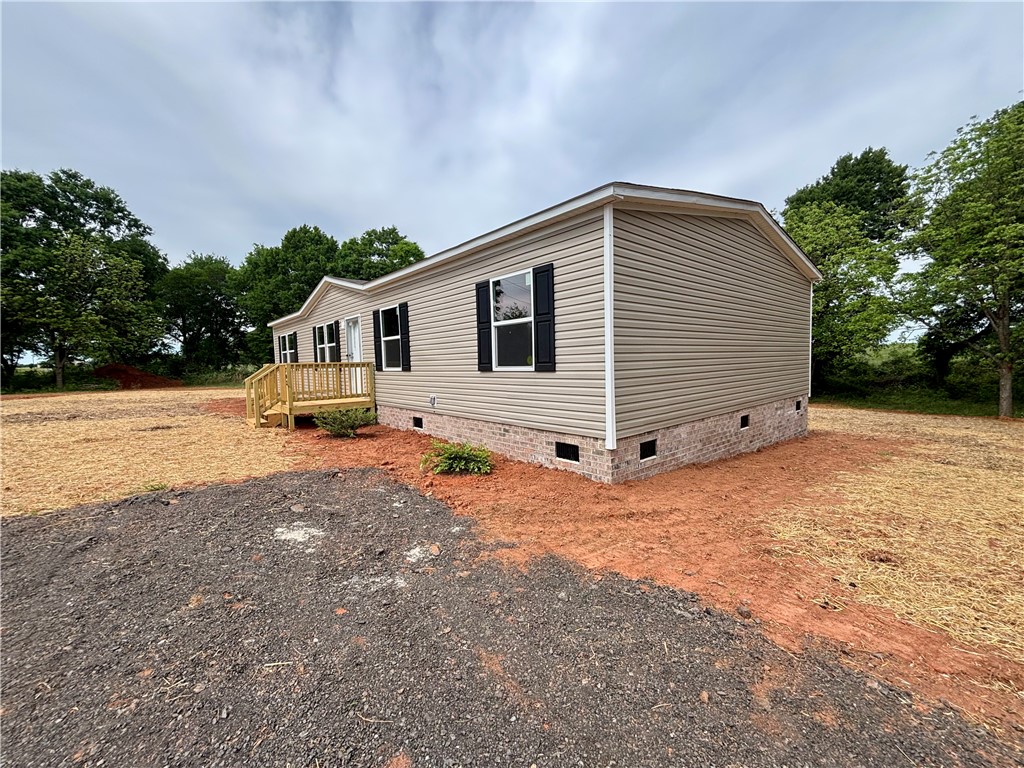703 Double Springs Road Townville, SC 29689 - Photo 2 of 22 This newly constructed residence offers a tranquil setting with ample outdoor space.