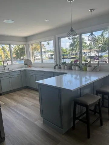 a bedroom with a large bed and a large window