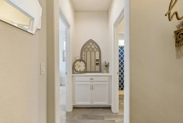 a bathroom with a sink a toilet a mirror and shower