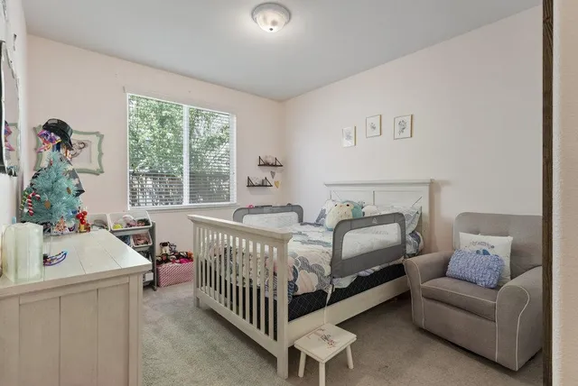 a bedroom with a bed and window