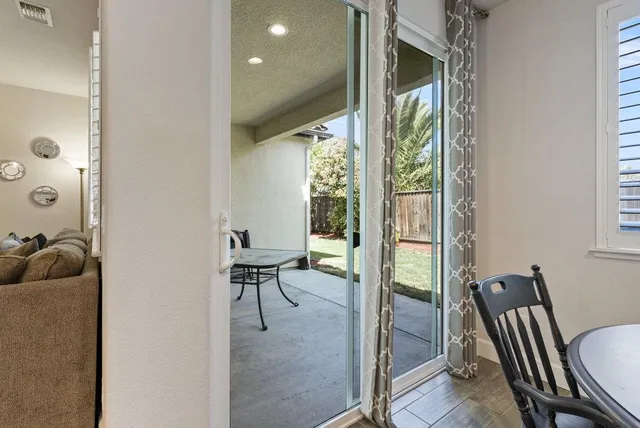 a hallway with painting and a window