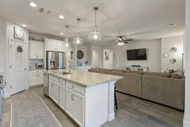 a view of a dining room with furniture and window