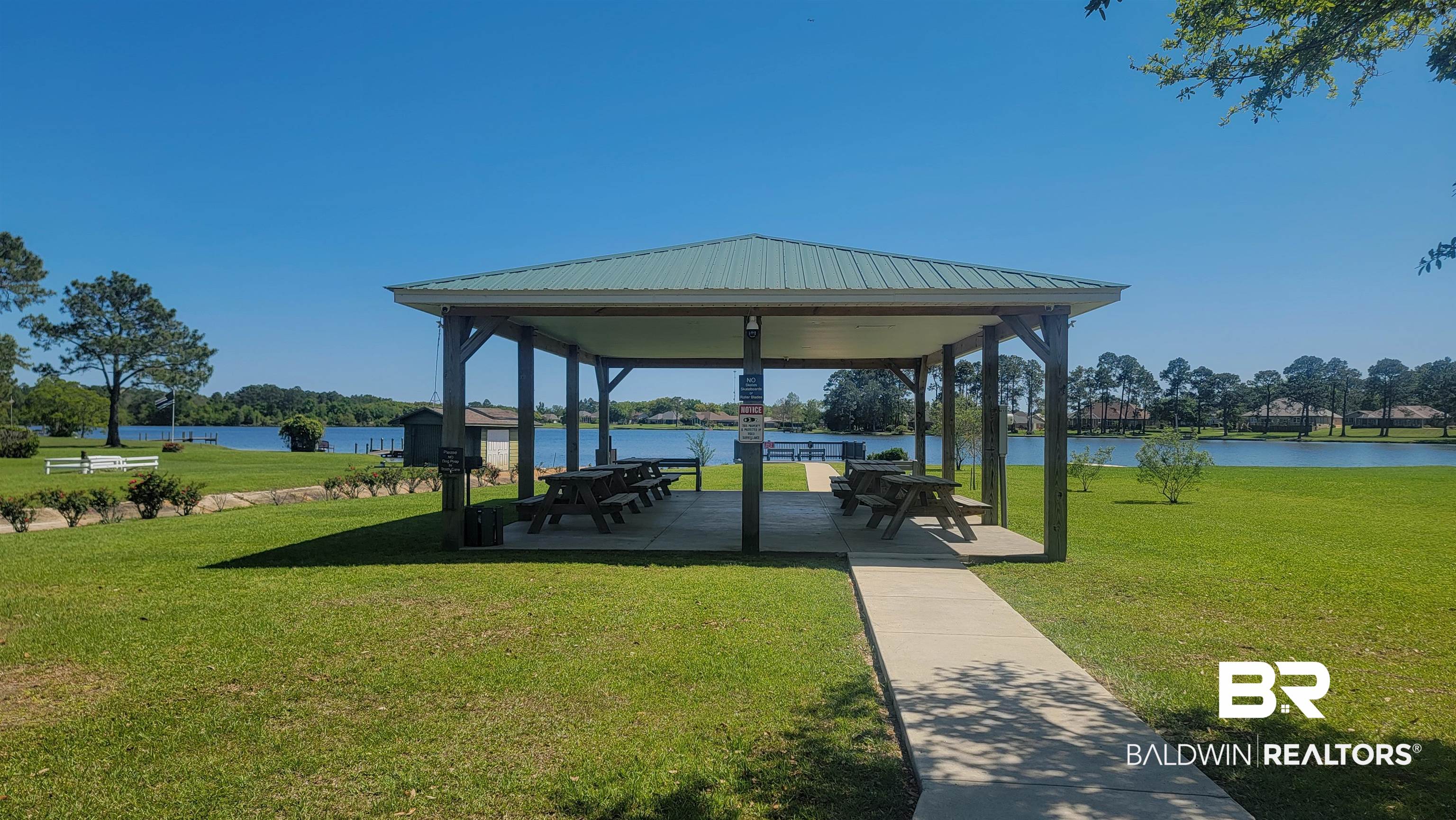 22512 Putter Lane Foley, AL 36535 - Photo 26 of 27 View of community with a gazebo, a patio, and a water view