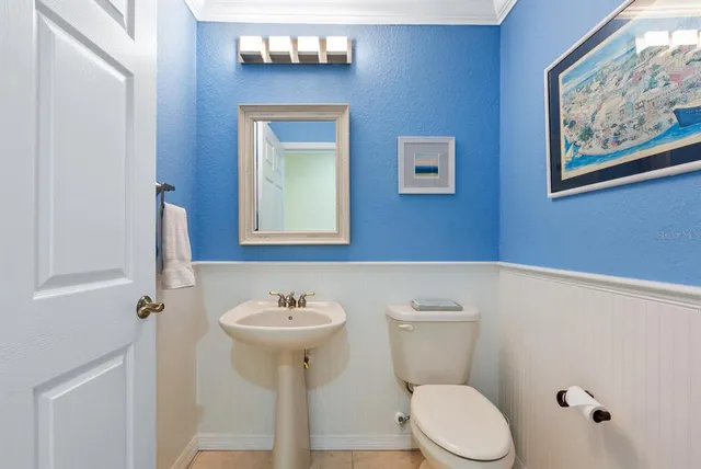a bedroom with a bed wooden floor and a window